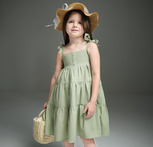 Maxi dress with ties for kids, featuring a flowy design and adjustable ties for a perfect fit