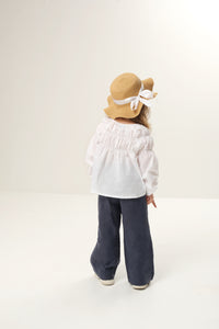 Wide leg linen trousers for kids, offering a breezy and comfortable fit with a stylish wide-leg design